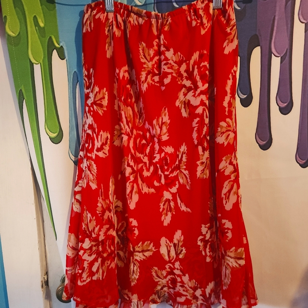 Small, Floral Red Skirt, Wavy Edge Bottom.